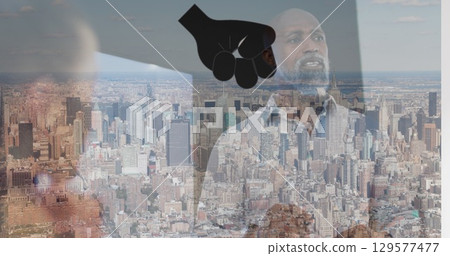 Image of hand icon over african american man in office and cityscape Image of hand icon over african american man in office and cityscape 129577477