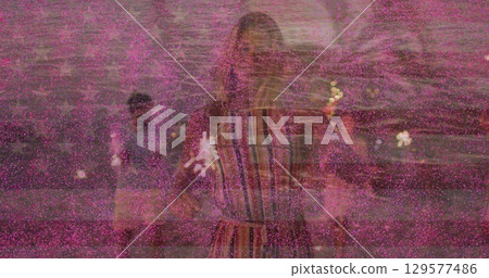 Image of 2022 and fireworks over happy caucasian woman over flag of usa Image of 2022 and fireworks over happy caucasian woman over flag of usa 129577486