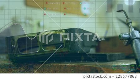 Image of statistics and data processing over welding glasses in factory Image of statistics and data processing over welding glasses in factory 129577868