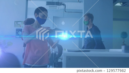 Image of diverse business people with face masks in office Image of diverse business people with face masks in office 129577982