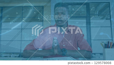 Image of financial data processing over african american businessman on image call 129578008