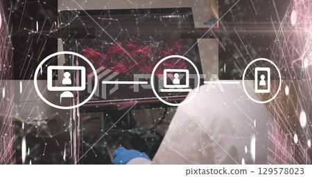 Image of media icons and shapes over hand using computer 129578023