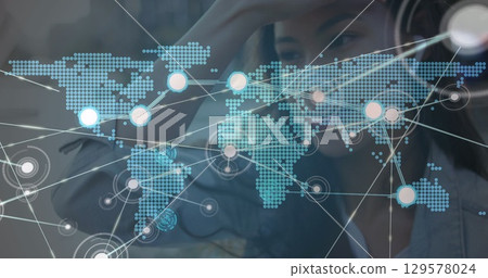 Image of network of connections with world map over woman using smartphone Image of network of connections with world map over woman using smartphone 129578024
