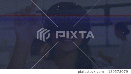 Image of interference over woman with vr headset Image of interference over woman with vr headset 129578079