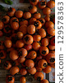 Persimmon harvest 129578363