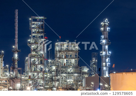 Oil and gas refinery plant at night, Global business energy logistic transportation, Oil and gas refinery petrochemical industrial, Petrochemical refinery industrial energy supply chain. Oil and gas refinery plant at night, Global business energy logistic transportation, Oil and gas refinery petrochemical industrial, Petrochemical refinery industrial energy supply chain. 129578605