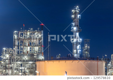 Oil and gas refinery plant at night, Global business energy logistic transportation, Oil and gas refinery petrochemical industrial, Petrochemical refinery industrial energy supply chain. 129578610