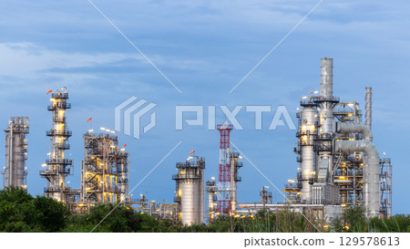 Oil and gas refinery plant at night, Global business energy logistic transportation, Oil and gas refinery petrochemical industrial, Petrochemical refinery industrial energy supply chain. 129578613