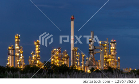 Oil and gas refinery plant at night, Global business energy logistic transportation, Oil and gas refinery petrochemical industrial, Petrochemical refinery industrial energy supply chain. 129578620