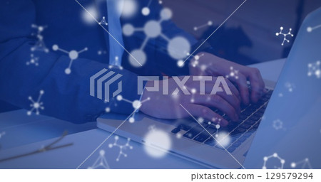 Image of molecules over caucasian man using laptop Image of molecules over caucasian man using laptop 129579294