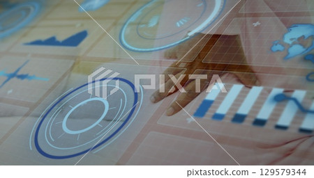 Image of digital screen with data over hands of african american senior woman with back pain Image of digital screen with data over hands of african american senior woman with back pain 129579344