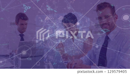 Image of dots and programming language over caucasian coworkers working over laptop 129579405