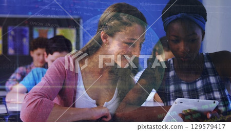 Image of globe, data over caucasian tutor teaching digital tablet to african girl in classroom 129579417
