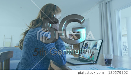 Image of 5g generation over caucasian woman having image call on laptop Image of 5g generation over caucasian woman having image call on laptop 129579502