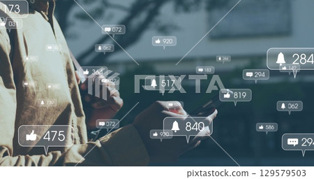 Image of data processing and social media speech bubbles over man using smartwatch 129579503