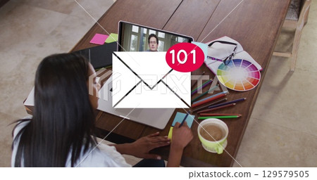 Image of email icon with numbers over caucasian woman on laptop image call 129579505