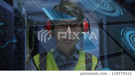 Image of data processing over asian male worker in server room Image of data processing over asian male worker in server room 129579521