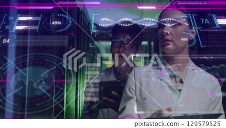 Image of data processing over diverse workers in server room 129579525
