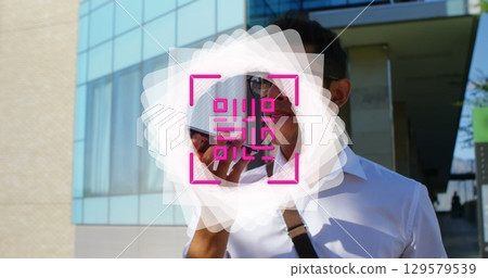 Image of shapes and qr code over man using smartphone Image of shapes and qr code over man using smartphone 129579539