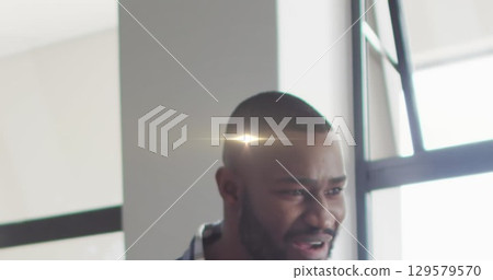 Image of light trails over african american male teacher Image of light trails over african american male teacher 129579570