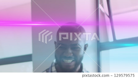 Image of light trails over african american male teacher Image of light trails over african american male teacher 129579575