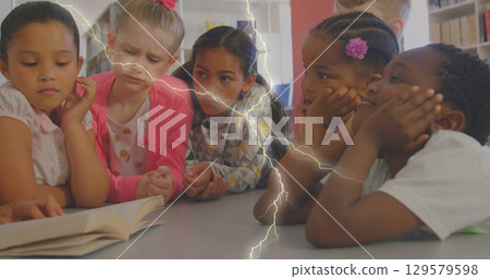 Image of lightning over diverse schoolchildren and teacher 129579598