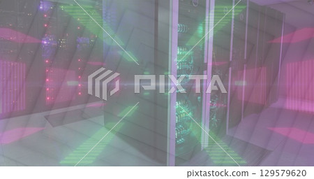 Image of flashing green and pink neon lights over computer server room 129579620