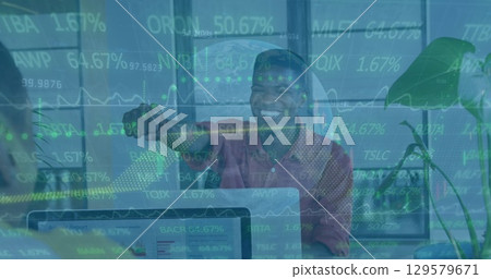 Image of financial data processing over smiling african american businessman 129579671