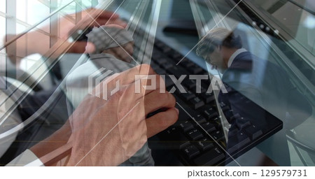 Image of hands using computer over diverse business people in office Image of hands using computer over diverse business people in office 129579731