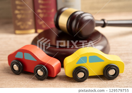 Hammer gavel judge with car vehicle accident, insurance coverage claim lawsuit court case. 129579755