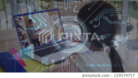 Image of round scanner and microprocessor connections against girl having a image call on laptop 129579757
