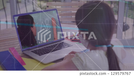 Image of data processing over rear view of girl wearing face mask having a image call on laptop Image of data processing over rear view of girl wearing face mask having a image call on laptop 129579767
