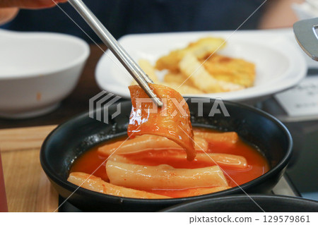 Korean traditional spicy food. Tteokbokki Korean traditional spicy food. Tteokbokki 129579861