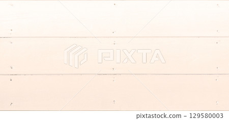 Background image of a horizontal wooden wall with the wood grain painted pale orange and nailed down Background image of a horizontal wooden wall with the wood grain painted pale orange and nailed down 129580003