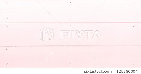 Background image of a horizontal wooden wall with pale red painted wood grain and nailed together 129580004
