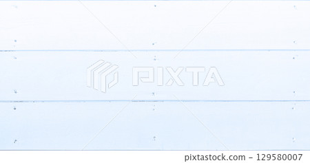 Background image of a horizontal wooden wall painted pale blue and nailed together Background image of a horizontal wooden wall painted pale blue and nailed together 129580007