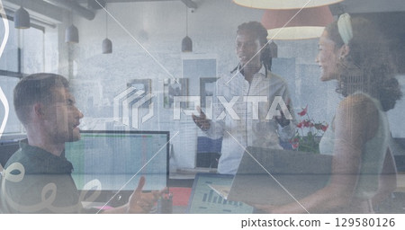 Image of hand icon over diverse businesspeople in office and cityscape Image of hand icon over diverse businesspeople in office and cityscape 129580126