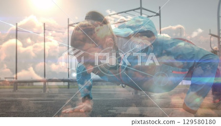 Image of network lines connecting dots, caucasian woman doing pushups at park 129580180
