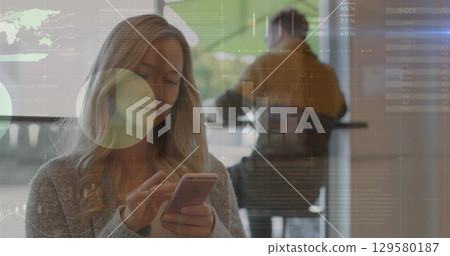 Image of network of connections over businesswoman in office 129580187