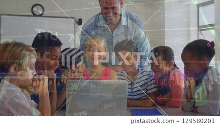 Image of globe, graph, programming code over multiracial teacher with students looking at laptop Image of globe, graph, programming code over multiracial teacher with students looking at laptop 129580201