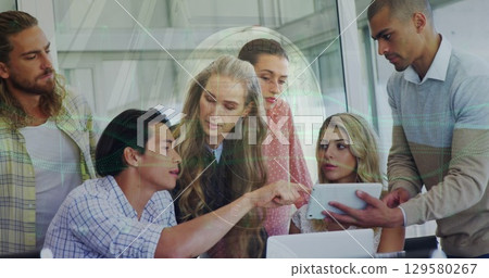 Image of graphs over diverse coworkers with tablet 129580267