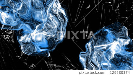 Image of white clouds of liquid over light on moving shiny black plastic 129580374