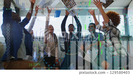 Showing portrait sheets, six business casual colleagues raising arms in modern office, with windows Showing portrait sheets, six business casual colleagues raising arms in modern office, with windows 129580403
