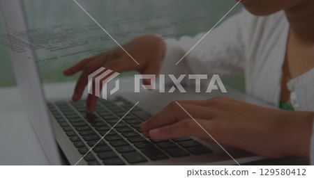 Image of data processing over asian girl using laptop Image of data processing over asian girl using laptop 129580412