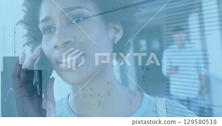 Image of financial data processing over african american woman using smartphone Image of financial data processing over african american woman using smartphone 129580518