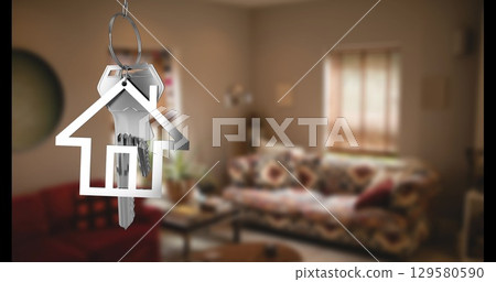 Image of silver key and house over house interior 129580590
