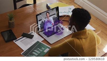 Image of 6g text banner over african american woman having a image call on laptop at home 129580610