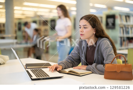 Student working at a notebook 129581226