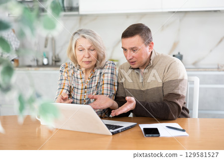 Old woman considering offer from agent Old woman considering offer from agent 129581527