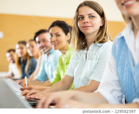 Woman using laptop in classroom during lecture Woman using laptop in classroom during lecture 129582397